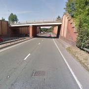 An inquest has opened into the death of a woman who died after falling from a bridge onto the A34 Birrell Way in Wilmslow