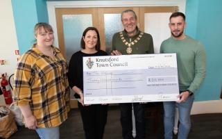 Outgoing mayor Cllr Peter Coan presents a grant to, from left, Sarah Pownall, Lucy Beesley and Nick Sherburn of The Welcome