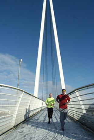 Runners over the M60 bridge