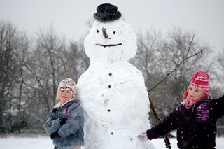 Amy & Helen worked with their friend Eddie to create this snowman in Worthington Park, Sale. Picture taken by their dad, Phil Cooper of Sale.