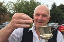 Champion grower Terry Price with his award-winning gooseberry which triumphed at last year's Goostrey show