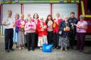 Members of the Mothers Union hand over the teddies to the firefighters of Knutsford Fire Station