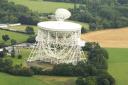 A giant crop circle showing Shortie the Jack Russell, mascot of the Ardbeg Distillery, seen from the Jodrell Bank space telescope