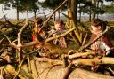 Children build a makeshift shelter during a Viking educational programme at Tatton Park