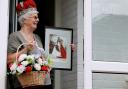 Liz Scott holding a picture of the day she was crowned May Day queen Pictures: Sarah King
