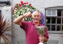 Jim Hart celebrates after winning the new premier berry trophy on his first appearance at the annual Crown of Peover Gooseberry Show Picture: Mike Godfrey