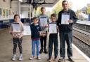 Winners of the Through The Train Window competition, from left, Eliza Bishop, Sam Bishop, Lucas Cronin, Ethan Morgan and David Morgan