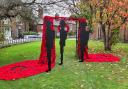 Holmes Chapel Community Yarn Bombers have created a stunning tribute to fallen war heroes from 3,500 red woollen poppies