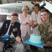 Peter Davies with his daughters and a member of 653 Air Army Corps celebrate his 100th birthday