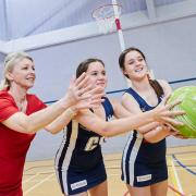 Netball players from Knutsford Academy with Redrow's Rachael Reece
