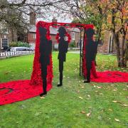 Holmes Chapel Community Yarn Bombers have created a stunning tribute to fallen war heroes from 3,500 red woollen poppies