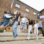 Knutsford Academy students Jamie Duncan, Emily Fozard, Anna Fletcher, Jemima Dunlop, Kirsty Marshall, and Alfred Fletcher jumping for joy