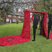 A crimson canopy of handmade poppies marks Remembrance Sunday at St Luke's Church in Holmes Chapel