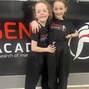 Up-and-coming kickboxing talent Alan Fagan, right, with her sister Carys