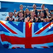 Tom Ford and his men's eight crewmates celebrate their gold medal