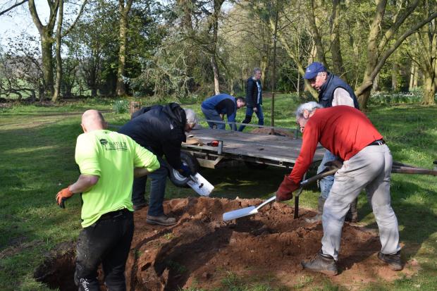 Knutsford Guardian: Council staff and volunteers from the Arboretum prepare the ground for planting (Credit Write Image for you Media)