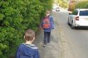 Children have to walk to school in single-file on the narrow Macclesfield Road path Picture: Elizabeth Alcock