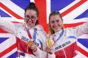 Great Britain's Laura Kenny, right, and Katie Archibald with their gold medals after winning the women's Madison Final at the Izu Velodrome on the fourteenth day of the Tokyo 2020 Olympic Games in Japan. Picture: PA