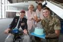 Peter Davies with his daughters and a member of 653 Air Army Corps celebrate his 100th birthday