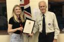 Amber Houghton receives her Queens' Scout Award from Tony Leadbetter, president of Knutsford Scouts