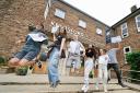 Knutsford Academy students Jamie Duncan, Emily Fozard, Anna Fletcher, Jemima Dunlop, Kirsty Marshall, and Alfred Fletcher jumping for joy