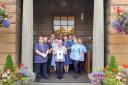Staff at Tabley House celebrate their achievement