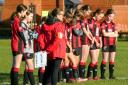 Holmes Chapel Hurricanes under 14s girls football team line up to pay respects to the fallen on Remembrance weekend, ahead of their Cheshire Girls League clash with Winsford Town. Picture: g.mooresportsnaturephotography