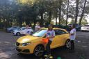 Staff take part in the car wash