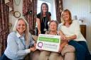 Amie Blott and Katie Brennan of Carefound Home Care Wilmslow celebrate the outstanding rating with client, Mrs Ratcliffe and her daughter Linda Smith