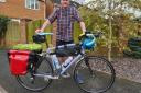 Cyclist Dave Evans packs his bike ready to ride from Lands  End to John O'Groats