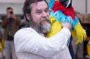 Michael Gallagher as Long John Silver with a parrot