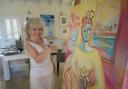 Artist Janice Sylvia Brock with one of her latest paintings