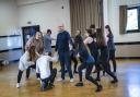 Oliver Ball as Shrek with cast in rehearsals