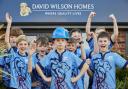 The Wilmslow Wolves under 11s delighted to receive a £1,000 donation from David Wilson Homes to fund their pre-season tour bus