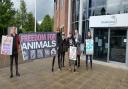 Campaigners join Katy Brown, far right, from Merseyside Animal Rights, to protest over plans to open an animal zoo at a Cheshire farm