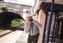 Photographer Paul Worpole captures a shot from a station platform Pictures: John Horsley