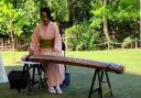 Sumie Kent plays the Koto, a Japanese harp at a Matsuri summer festival in Tatton Park
