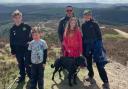 Dylan Peterson, brother Robin, dad Alex, sister Betty, mum Beverley and dog Pepper at the summit of Moel Famau