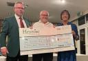 Nick Shennan, outgoing Heyrose Golf Club captain, Adrian Rees, chairman Knutsford Community First Responders Trust Kathy Smith, outgoing ladies captain