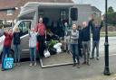 Nilgun Oneren, far left, with Mobberley parish Cllrs David Swan, fourth from left, Cllr Karen Baker, fourth from right, and villagers loading a horsebox with donations for Turkey