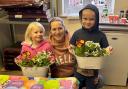 Harry Blain, right, and sister Olivia make a flower planter Mother's Day gift for mum Vicky