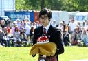 Crown bearer Toby Hui prepares to carry out his ceremonial duties at The Heath