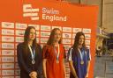 Eloise Perritt, centre, of Knutsford Vikings at the medal presentation ceremony