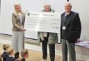 Andrea Booth, head teacher of Handforth Grange Primary School receives a cheque from Cllrs Susan Moore and  Roger Small