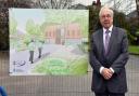 Police and Crime Commissioner John Dwyer beside an artist impression of the new Wilmslow police station