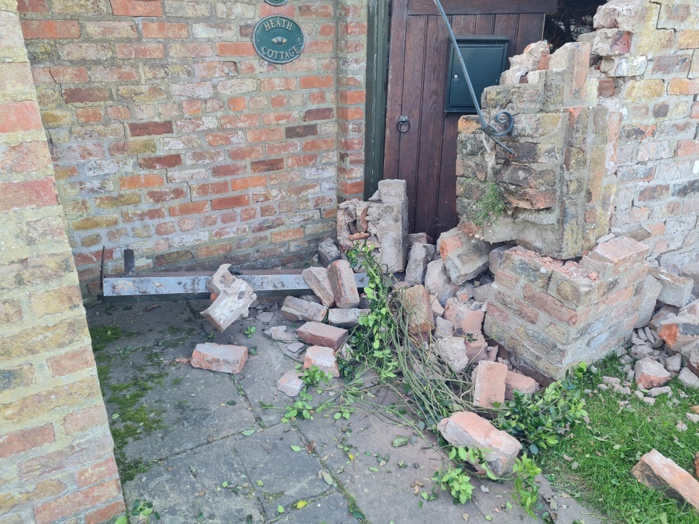 Garden wall demolished outside Nigel Parkinsons cottage on Heath Lane