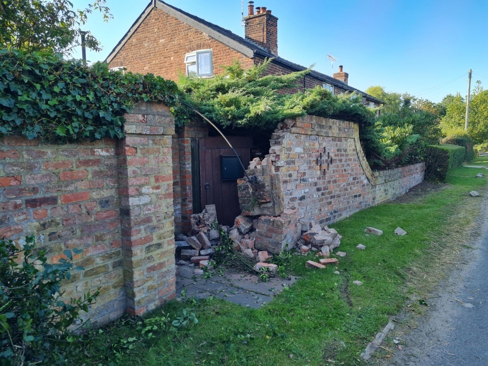 The garden wall outside Nigel Parkinsons cottage on Heath Lane was demolished when a trailer became detached from a tractor and ploughed into his garden