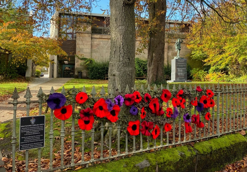 Volunteers have knitted hundreds of poppies including this display on the railing outside the war memorial