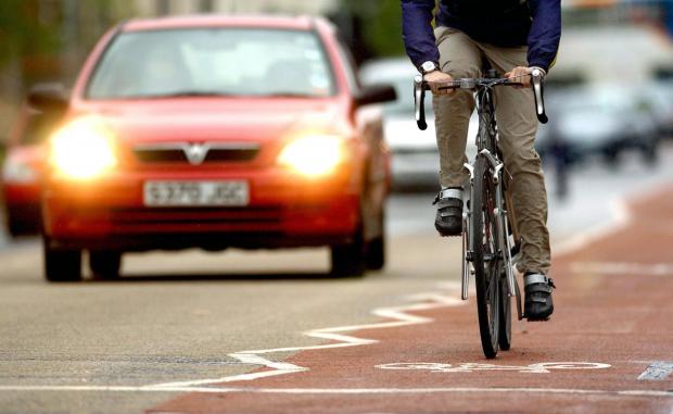 Knutsford Guardian: Photo via PA shows a cyclist on the road near traffic.