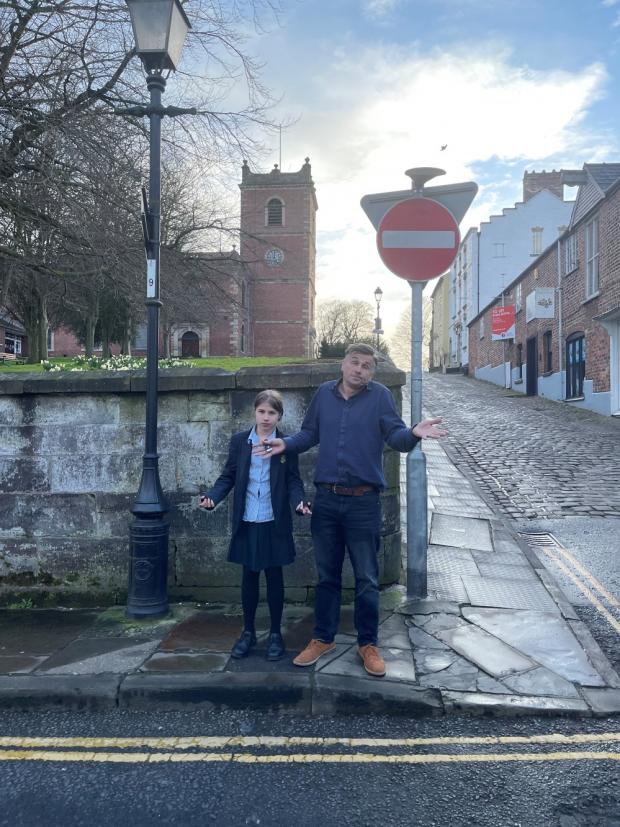 Knutsford Guardian: Clara Wilkinson and dad Steve at the spot near St John's churchyard where Knutty went missing